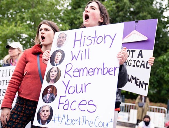 Protesters demonstrate outside the U.S. Supreme Court in response to the leaked draft opinion indicating the Court will overturn Roe v. Wade, on Mother's Day, Sunday, May 8, 2022. (Tom Williams/CQ Roll Call via AP Images)
