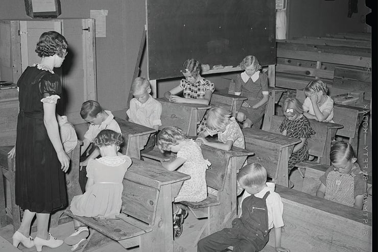 above: A June 1940 school day opens with prayer at a private school at the Farm Bureau Building in Pie Town, New Mexico. (Lee Russell / Library of Congress)