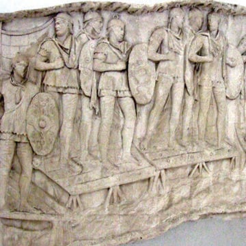 a panel from Trajan’s Column in Rome depicting Roman auxilia soldiers