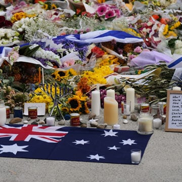 A tribute at a flower memorial by the Bondi Pavilion at Bondi Beach Cardinal George Pell, judgmentalism, Nigerian Christians, Australia, Catholic Bishops, Bondi Beach, shooting, third-world immigrants,