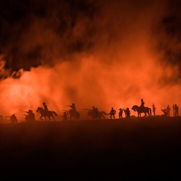 American Civil War Concept. Military silhouettes fighting scene on war fog sky background. Attack scene. The False Ghosts of the Confederacy