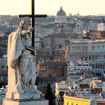 Colosseum, St. Peter's and Castel Sant'Angelo against the backdrop of statues of saints. Rome, Italy. Trump Should Strike Back as Vatican Escalates Its War Against Him