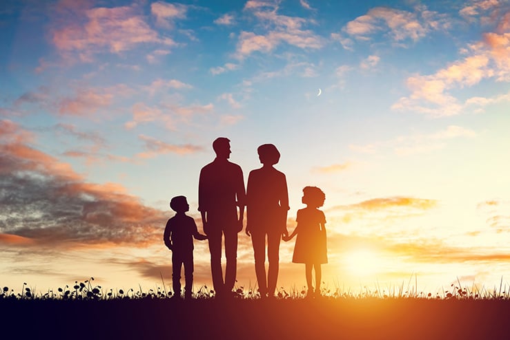 Happy family together at sunset. Parents with their children Former White House Official Examines ‘What Really Matters’