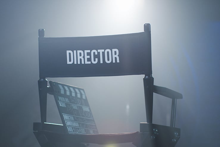 Chair of director with clapboard in spotlight Hollywood Elites Get Their Comeuppance from YouTubeWood