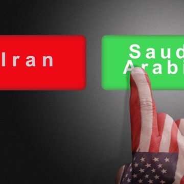 Hand with the colors of the American flag chooses Saudi Arabia against Iran The Perilous Saudi Deal