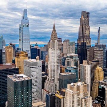 Midtown Manhattan skyline with Chrysler Building. Aerial drone photo of Midtown Manhattan skyline with the Chrysler Building and other iconic skyscrapers. The Bonfire of Open Borders